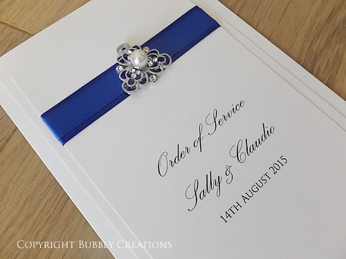 wedding order of service booklet in royal blue with pearl and diamante embellishment