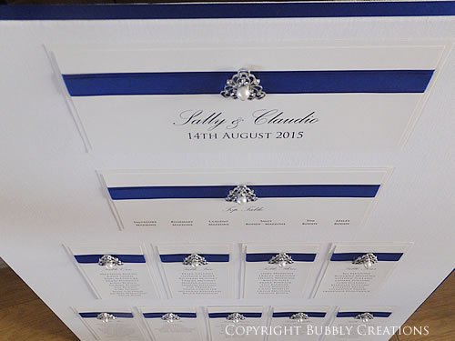 wedding seating table plan in royal blue with a pearl and diamante crystal embellishment